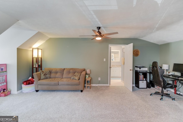 interior space with ceiling fan, baseboards, and vaulted ceiling