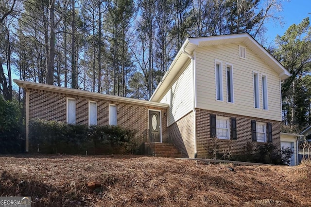 view of front of home featuring brick siding