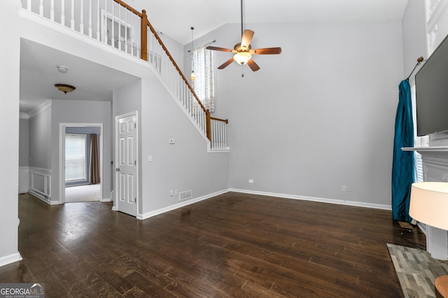 unfurnished living room with visible vents, a ceiling fan, stairway, dark wood-style flooring, and high vaulted ceiling