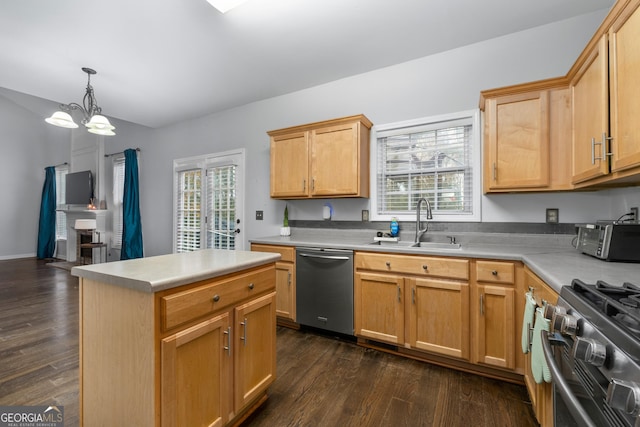 kitchen with range, a center island, light countertops, stainless steel dishwasher, and a sink