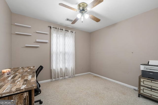 home office featuring ceiling fan, visible vents, baseboards, and light colored carpet