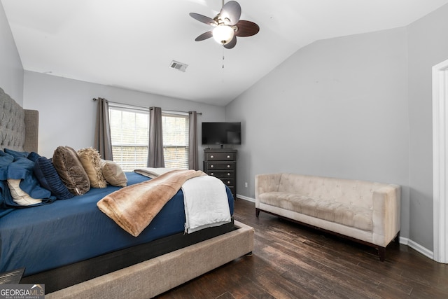 bedroom featuring baseboards, visible vents, dark wood-style floors, ceiling fan, and vaulted ceiling