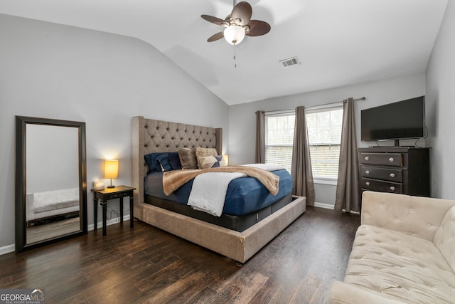 bedroom featuring dark wood-style floors, lofted ceiling, visible vents, and baseboards