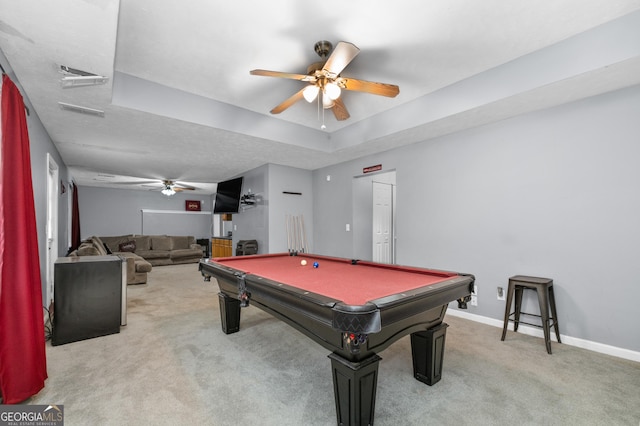 rec room with a tray ceiling, light carpet, ceiling fan, billiards, and baseboards