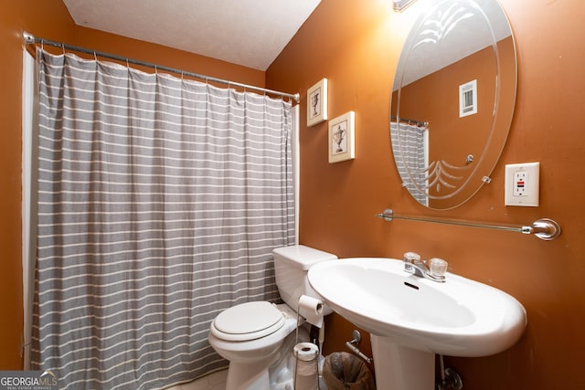 full bathroom featuring a sink and toilet