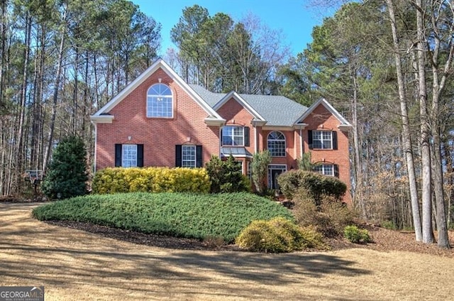 traditional-style home with brick siding