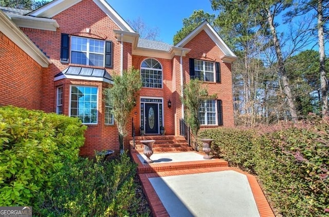 view of front facade featuring brick siding
