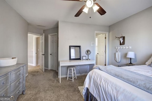 bedroom featuring carpet floors, visible vents, ceiling fan, and baseboards