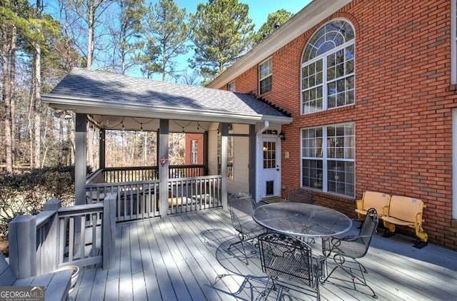 deck with outdoor dining space