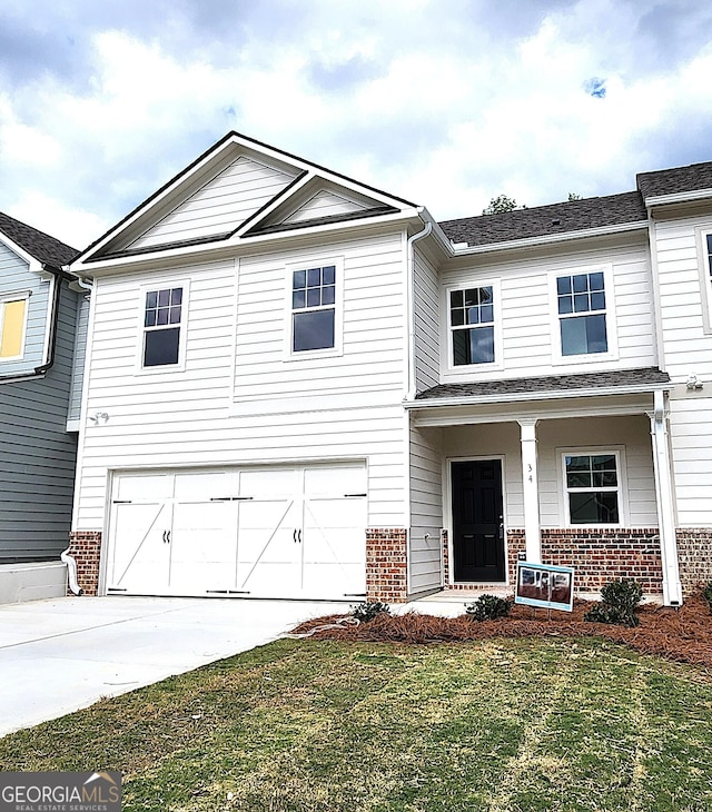 34 Russet Way Lot 57, Newnan, GA 30263 - view of front of house with brick siding, a garage, concrete driveway, and a front yard
