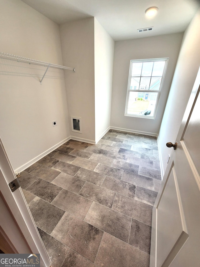 34 Russet Way Lot 57, Newnan, GA 30263 - washroom with hookup for an electric dryer, baseboards, stone finish flooring, and hookup for a washing machine