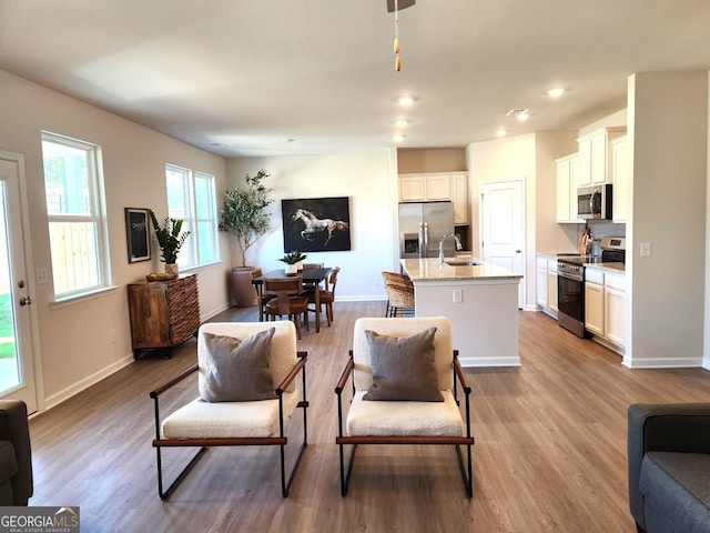 34 Russet Way Lot 57, Newnan, GA 30263 - living room with wood finished floors, baseboards, and recessed lighting
