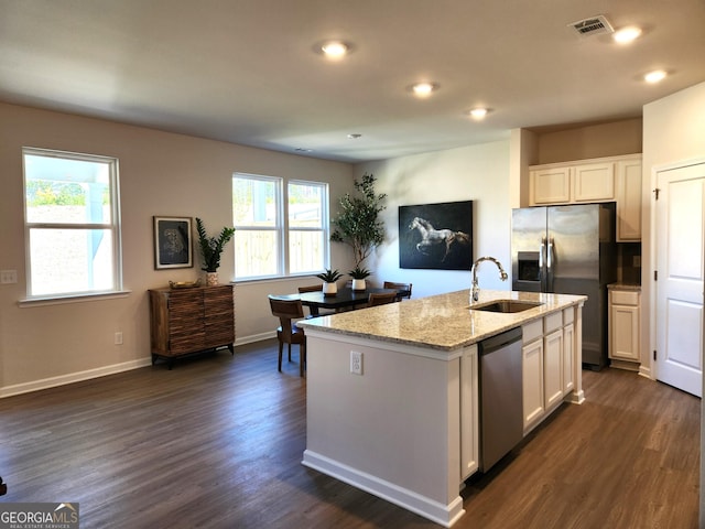 34 Russet Way Lot 57, Newnan, GA 30263 - kitchen featuring appliances with stainless steel finishes, a sink, light stone counters, dark wood-style flooring, and white cabinetry