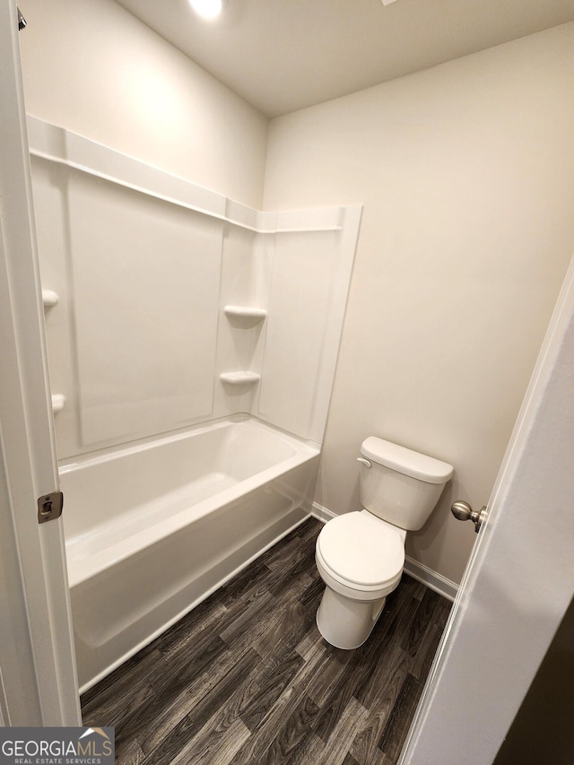 34 Russet Way Lot 57, Newnan, GA 30263 - full bath featuring wood finished floors, toilet, baseboards, and washtub / shower combination