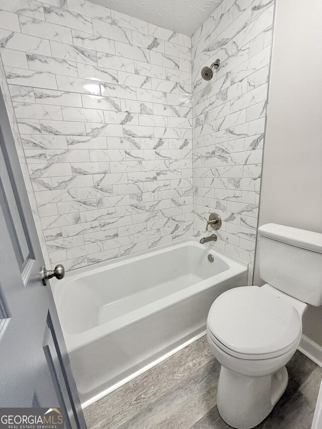 laundry room featuring washer hookup, wood finished floors, electric dryer hookup, and baseboards