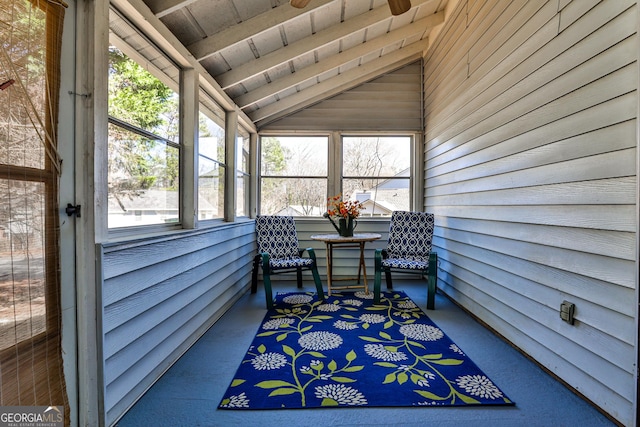 sunroom featuring lofted ceiling and wood ceiling