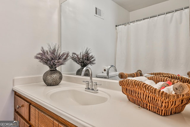 full bathroom with visible vents and vanity