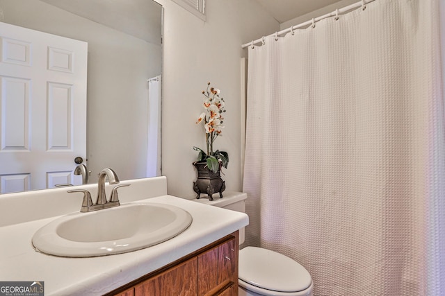 full bath featuring toilet and vanity