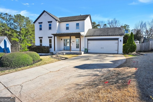 view of front of home featuring an attached garage, covered porch, driveway, and fence