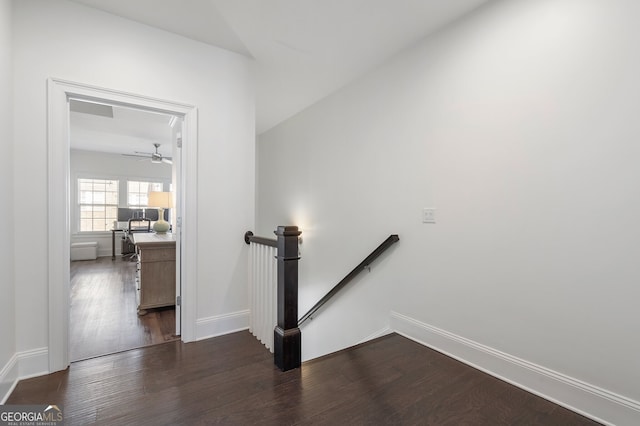 stairs with baseboards and wood finished floors