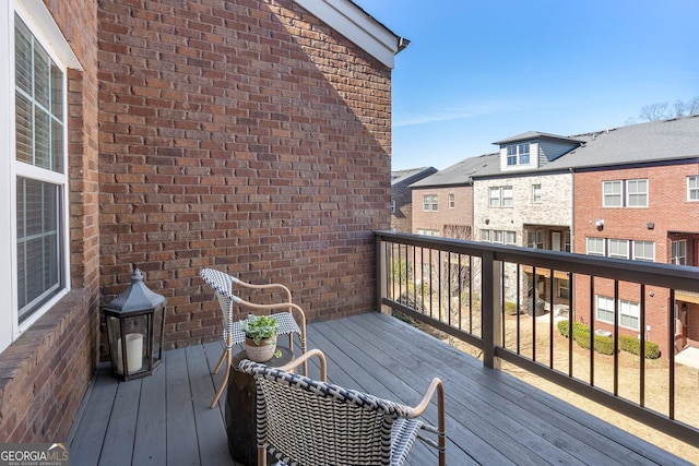 wooden terrace with a residential view