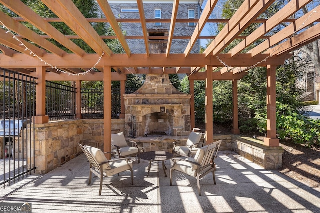 view of patio / terrace with an outdoor stone fireplace and a pergola