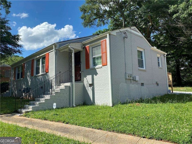 view of front of house featuring brick siding