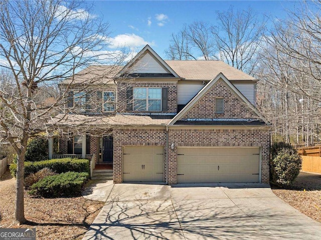 view of front of house with concrete driveway and brick siding