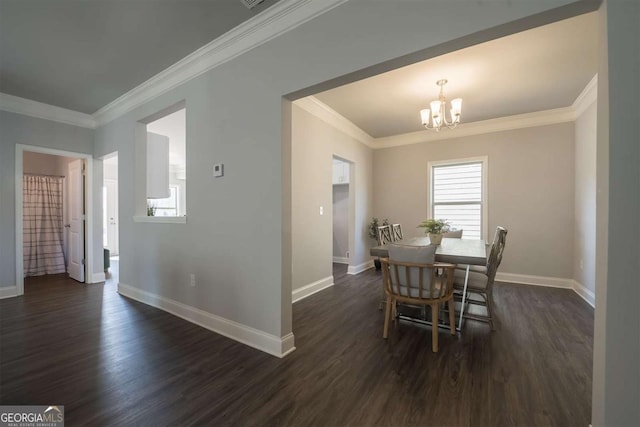 dining room with dark wood-style floors, baseboards, a notable chandelier, and crown molding