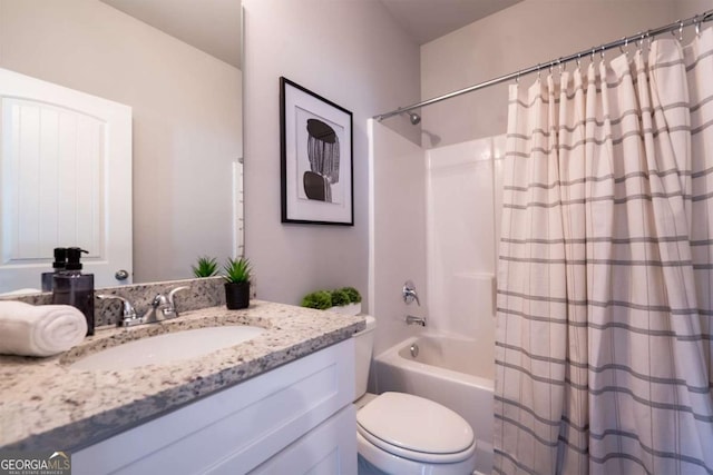 bathroom featuring toilet, shower / bath combo with shower curtain, and vanity