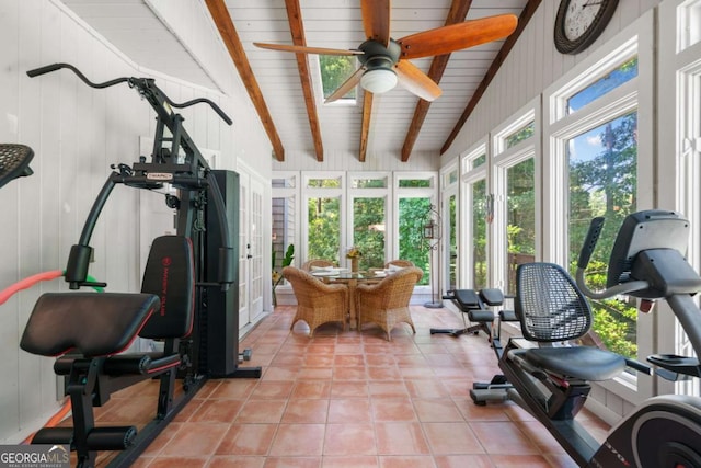 sunroom / solarium featuring ceiling fan and lofted ceiling with beams