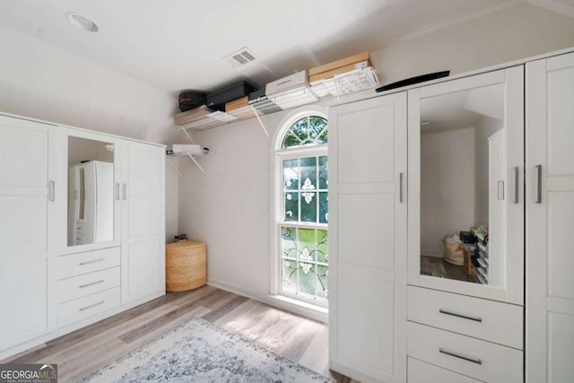 walk in closet with visible vents and light wood-style flooring