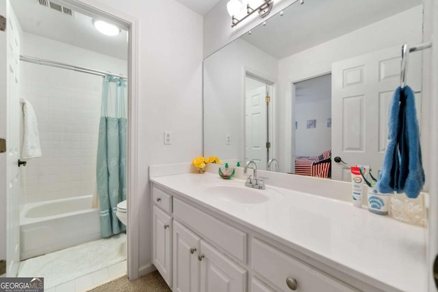 full bathroom featuring toilet, shower / bath combo, visible vents, and vanity