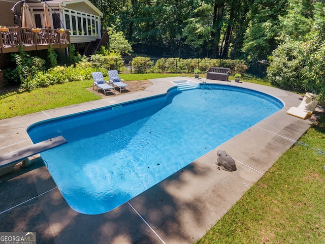 view of pool with a fenced in pool, a yard, a patio, fence, and a diving board