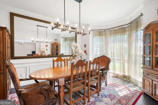 dining area featuring crown molding