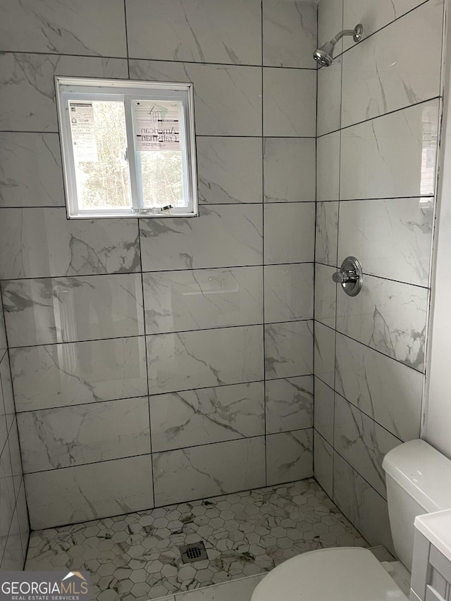 full bathroom with a shower stall and toilet