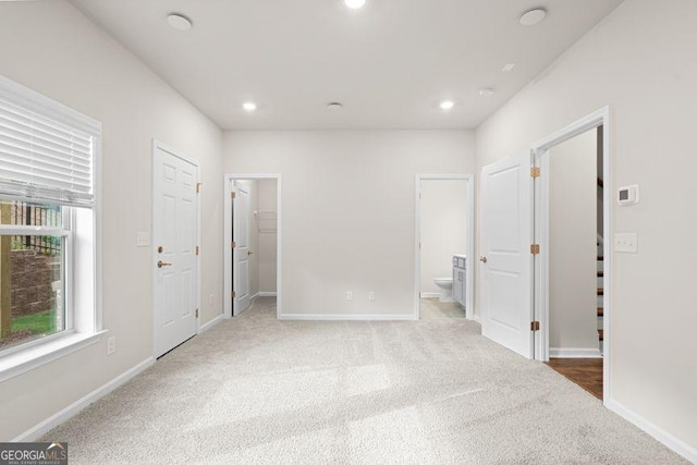 unfurnished bedroom featuring recessed lighting and baseboards