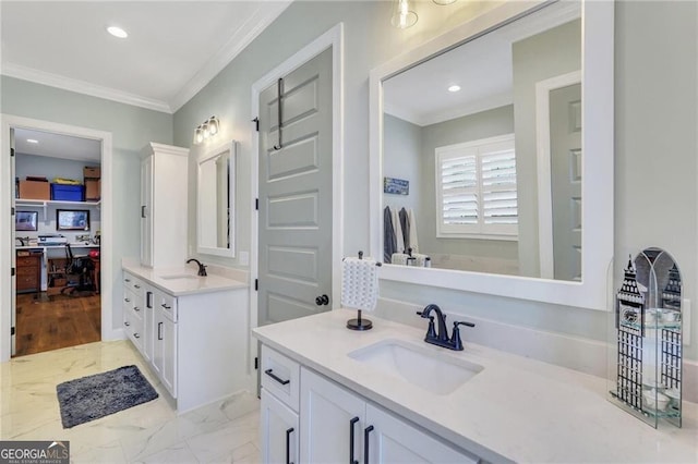 bathroom featuring ornamental molding, a sink, marble finish floor, two vanities, and recessed lighting