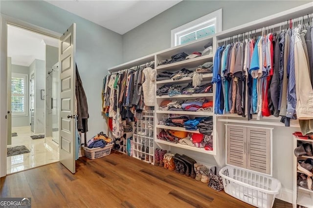 spacious closet with wood finished floors