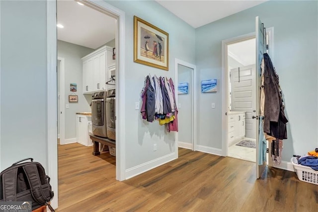 entryway featuring baseboards and wood finished floors