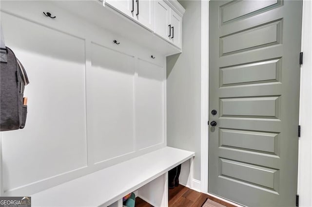 mudroom with dark wood-style floors