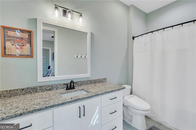 full bathroom featuring vanity and toilet