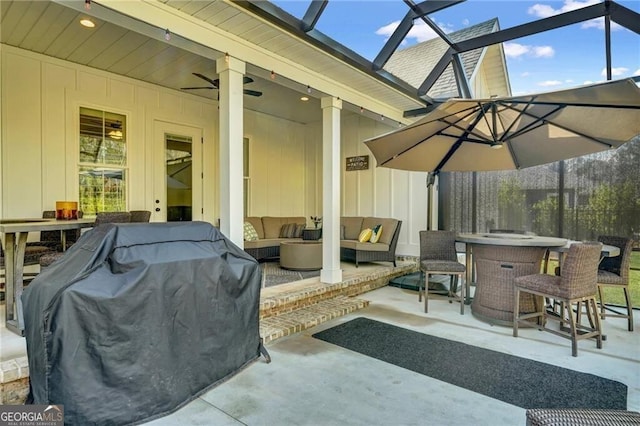 view of patio / terrace with an outdoor hangout area, grilling area, and a ceiling fan