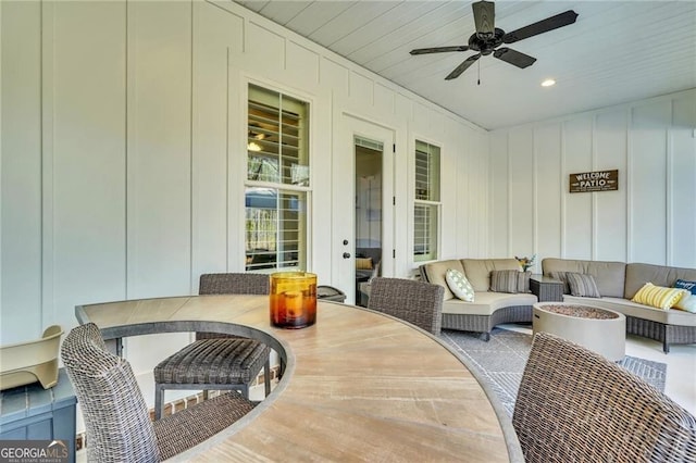 view of patio / terrace with outdoor dining space, outdoor lounge area, and a ceiling fan