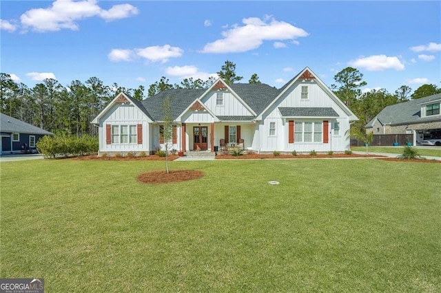 modern farmhouse featuring board and batten siding and a front lawn