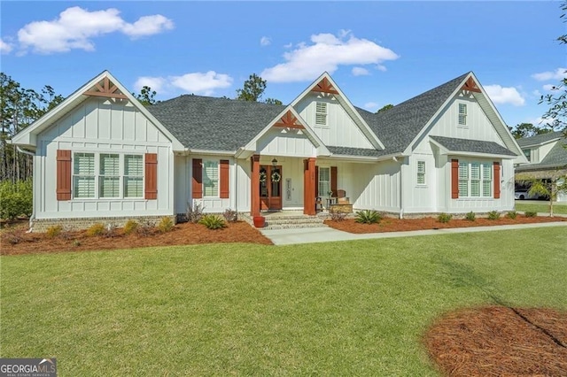 modern farmhouse with a shingled roof, board and batten siding, and a front yard