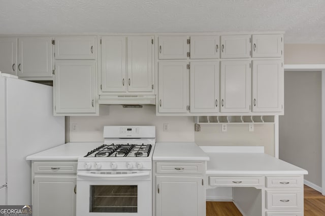 kitchen featuring light countertops, white appliances, white cabinets, and under cabinet range hood