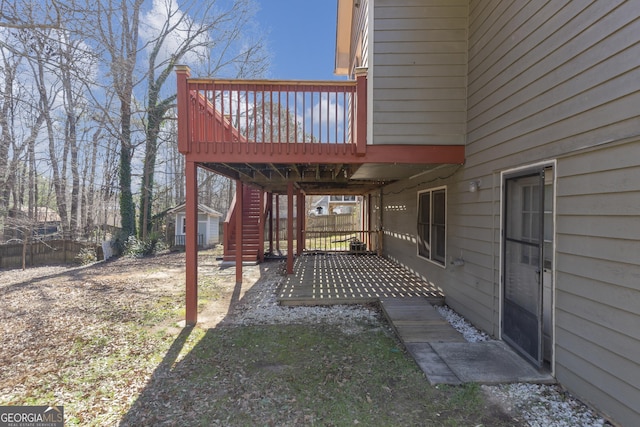 view of yard featuring stairway and a wooden deck