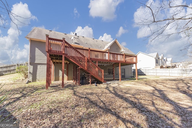 back of house featuring stairway, fence, and a wooden deck