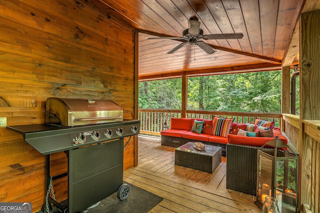 wooden deck with an outdoor living space, area for grilling, and a ceiling fan